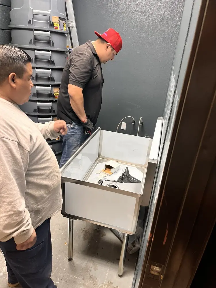 Commercial plumbing and sink installation in Corcoran